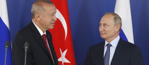 Turkish President Recep Tayyip Erdogan, left, shakes hands with Russian President Vladimir Putin during a joint news conference following their talks on the sidelines of the MAKS-2019 International Aviation and Space Show in Zhukovsky, outside Moscow, Russia, Tuesday, Aug. 27, 2019. Turkish President is on a short working visit in Russia.  - Sputnik International