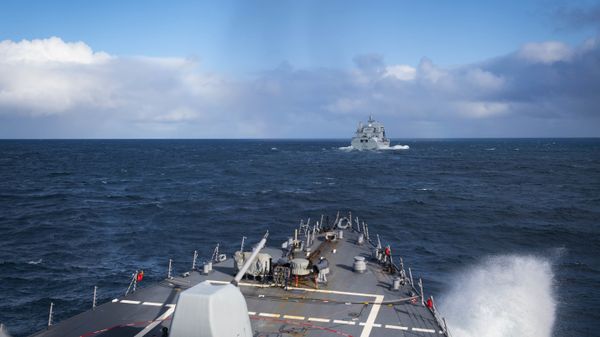The Arleigh Burke-class guided-missile destroyer USS Donald Cook (DDG 75) approaches the Royal Fleet Auxiliary Tide-class replenishment tanker Tidesurge (A138) for a refueling at sea, Oct. 18, 2019.  - Sputnik International