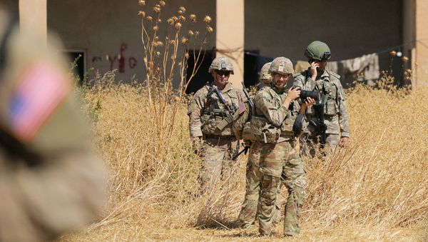 Turkish and American soldiers stand near a former YPG military point during a joint U.S.-Turkey patrol, near Tel Abyad, Syria September 8, 2019 - Sputnik International