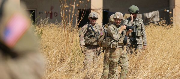 Turkish and American soldiers stand near a former YPG military point during a joint U.S.-Turkey patrol, near Tel Abyad, Syria September 8, 2019 Turkish and American soldiers stand near a former YPG military point during a joint U.S.-Turkey patrol, near Tel Abyad, Syria September 8, 2019 - Sputnik International