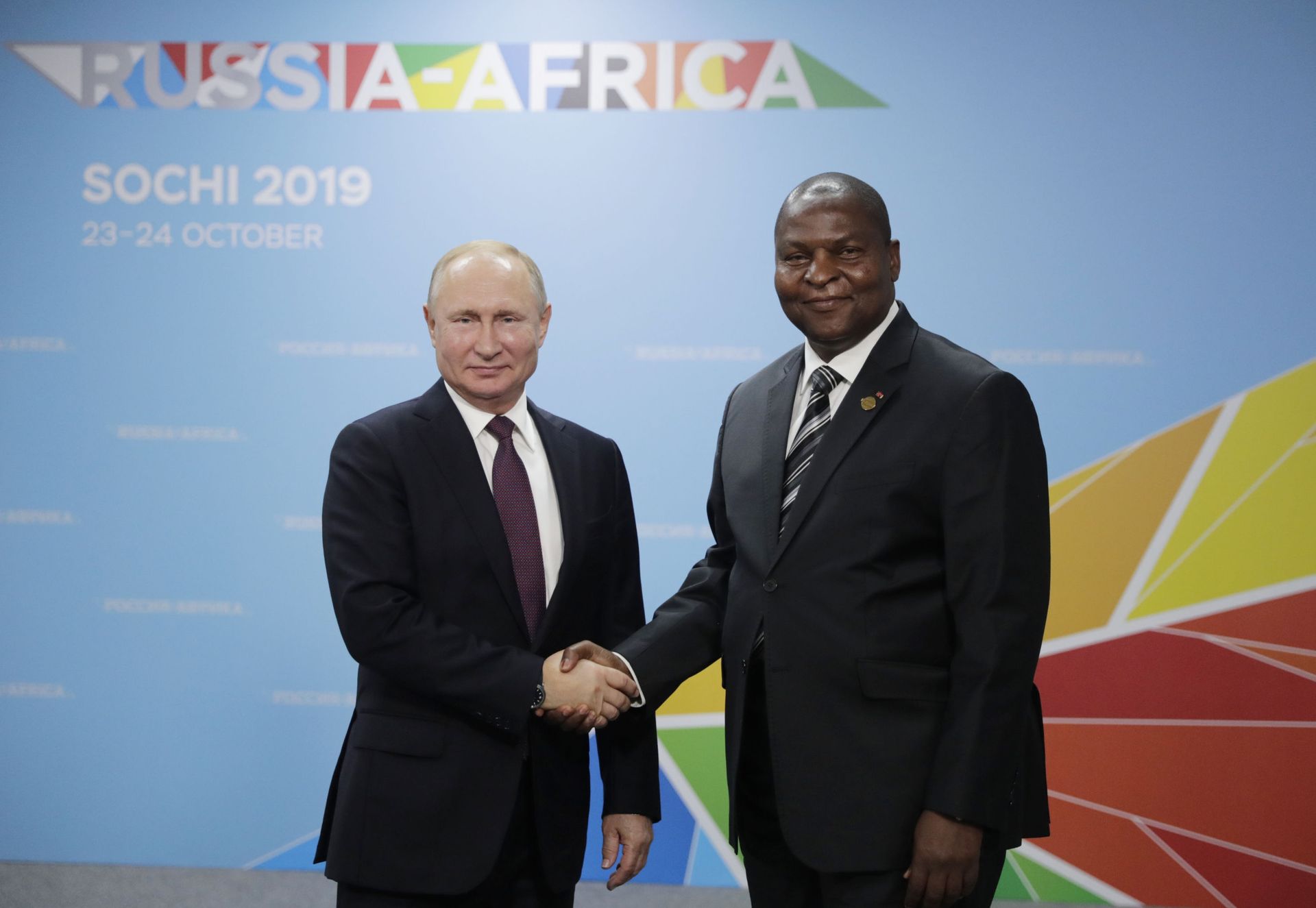 Russian President Vladimir Putin and Central African Republic President Faustin Archange Touadera shake hands as they pose for a photo prior to their meeting at the 2019 Russia-Africa Summit and Economic Forum in Sochi, Russia Russian President Vladimir Putin and Central African Republic President Faustin Archange Touadera shake hands as they pose for a photo prior to their meeting at the 2019 Russia-Africa Summit and Economic Forum in Sochi, Russia - Sputnik International, 1920, 11.10.2022