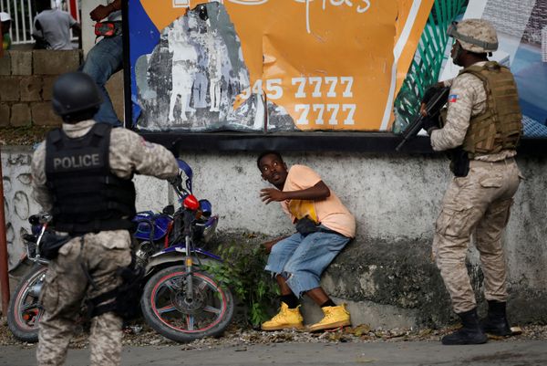 A man reacts in front of Haitian National Police (PNH) officers during clashes with protesters marching to demand the resignation of Haitian President Jovenel Moise, in the streets of Petion Ville, Port-au-Prince, Haiti October 20, 2019. A man reacts in front of Haitian National Police (PNH) officers during clashes with protesters marching to demand the resignation of Haitian President Jovenel Moise, in the streets of Petion Ville, Port-au-Prince, Haiti October 20, 2019. - Sputnik International