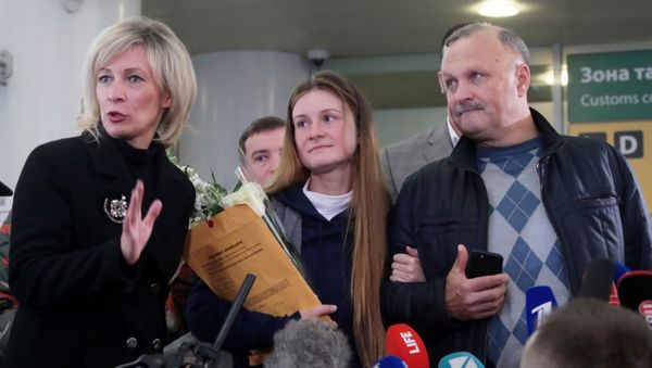 Russian Foreign Ministry's spokeswoman Maria Zakharova, convicted Russian agent Maria Butina, who was released from a Florida prison and then deported by U.S. immigration officials, and her father Valery Butin speaks to the media upon Butina's arrival at Sheremetyevo International Airport outside Moscow, Russia.  - Sputnik International
