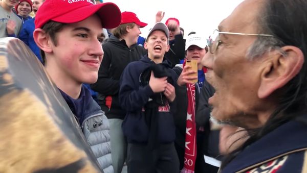 MAGA-wearing US high-school students in Washington DC allegedly surround and mock Native American chanting to honor war dead, Friday, January 18, 2019. - Sputnik International
