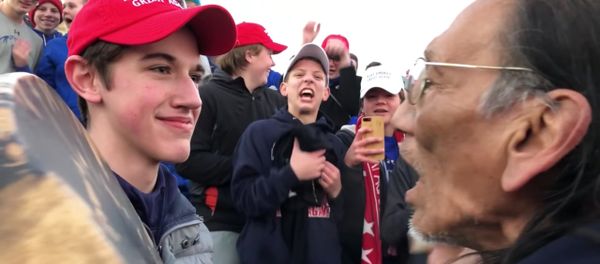 MAGA-wearing US high-school students in Washington DC allegedly surround and mock Native American chanting to honor war dead, Friday, January 18, 2019. MAGA-wearing US high-school students in Washington DC allegedly surround and mock Native American chanting to honor war dead, Friday, January 18, 2019. - Sputnik International