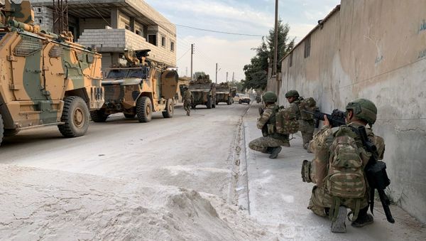 Turkish soldiers are seen in the border town of Tal Abyad, Syria, in this undated handout photo released by Turkish Defence Ministry on October 17, 2019 - Sputnik International