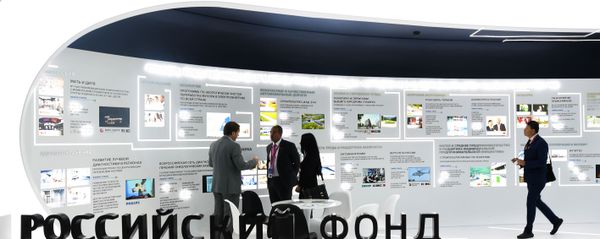 People visit the stand of the Russian Direct Investment Fund (RDIF) during the St. Petersburg International Economic Forum (SPIEF) People visit the stand of the Russian Direct Investment Fund (RDIF) during the St. Petersburg International Economic Forum (SPIEF) - Sputnik International