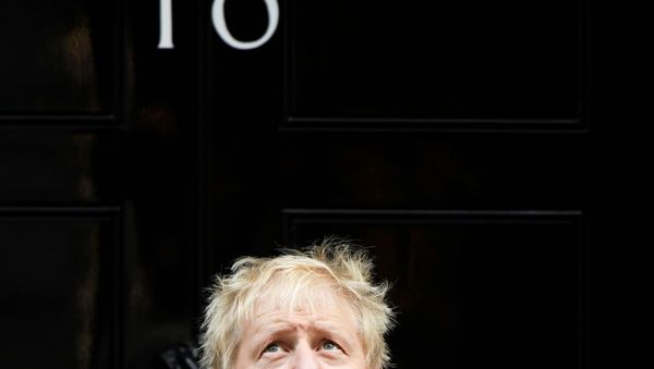 Britain's Prime Minister Boris Johnson reacts as he poses for a photo during a meeting with fundraisers for the Royal British Legion outside Downing Street in London, Britain October 28, 2019.  - Sputnik International