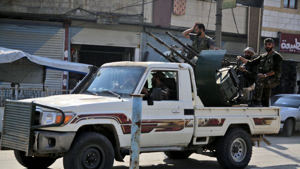 Turkish-backed Syrian fighters patrol the northern Syrian Kurdish town of Tal Abyad on the border between Syria and Turkey on October 31, 2019.  - Sputnik International