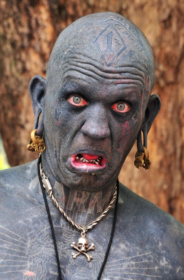 Lucky Diamond Rich from New Zealand, who in 2006 earned the Guinness World Record as the world's most tattooed person. His body is 100 per cent tattooed, including the insides of his eyelids, mouth, ears and foreskin. Lucky Diamond Rich from New Zealand, who in 2006 earned the Guinness World Record as the world's most tattooed person. His body is 100 per cent tattooed, including the insides of his eyelids, mouth, ears and foreskin. - Sputnik International