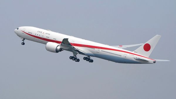 The Japanese government's new official aircraft for VIPs, a Boeing 777-300ER, takes off with Prime Minister Shinzo Abe from Tokyo's Haneda Airport on April 22, 2019 for his visit to Europe, the US and Canada. - Sputnik International