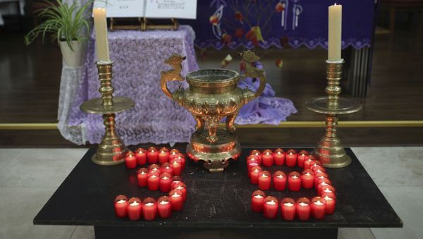 Candles are arranged in a 39 during a Mass and vigil for the 39 victims found dead inside the back of a truck in Grays, Essex, at The Holy Name and Our Lady of the Sacred Heart Church, east London's Vietnamese church on Saturday, Nov. 2, 2019. - Sputnik International