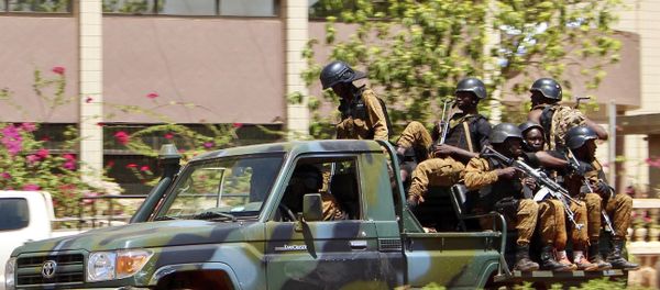 Troops ride in a vehicle near the French Embassy in central Ouagadougou, Burkina Faso Troops ride in a vehicle near the French Embassy in central Ouagadougou, Burkina Faso - Sputnik International