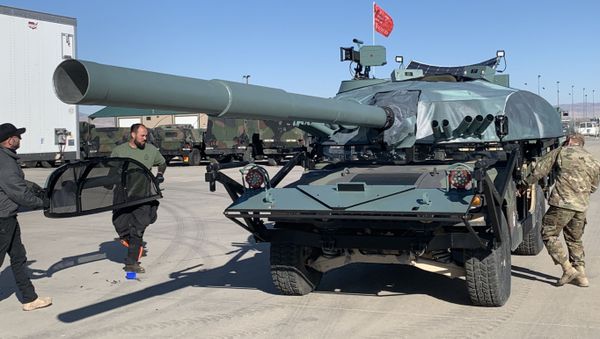 Employees of Westefx, a Hollywood special effects company, and a team of Idaho Army National Guardsmen transform an M1097 HMMWV into a T-72 Main Battle Tank using a visual modification kit at the Orchard Combat Training Center, Oct 16 - Sputnik International