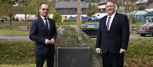 German Foreign Minister Heiko Maas and U.S. Secretary of State Mike Pompeo pose next to a memorial stone In honor of the 2d Armored Cavalry Regiment soldiers who patrolled along the Iron Curtain to protect freedom and peace in Western Europe during their visit to the village of Moedlareuth near Hof, Germany November 7, 2019 German Foreign Minister Heiko Maas and U.S. Secretary of State Mike Pompeo pose next to a memorial stone In honor of the 2d Armored Cavalry Regiment soldiers who patrolled along the Iron Curtain to protect freedom and peace in Western Europe during their visit to the village of Moedlareuth near Hof, Germany November 7, 2019 - Sputnik International