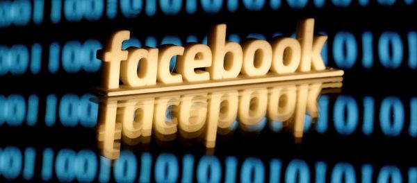 A 3-D printed Facebook logo is seen in front of displayed binary code in this illustration picture, June 18, 2019 A 3-D printed Facebook logo is seen in front of displayed binary code in this illustration picture, June 18, 2019 - Sputnik International
