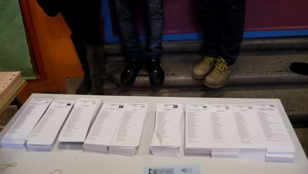 Photographers take pictures of ballots in a polling station ahead of general election in Madrid, Spain November 9, 2019. REUTERS/Jon Nazca - Sputnik International