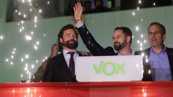 Santiago Abascal, leader of far-right Vox Party, waves to supporters as fireworks go off outside the party headquarters after the announcement of the general election first results, in Madrid, Sunday, Nov. 10, 2019. - Sputnik International