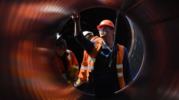 Employees work at the construction site of the Nord Stream 2 pipeline outside the town of Kingisepp, Leningrad region, Russia.  - Sputnik International