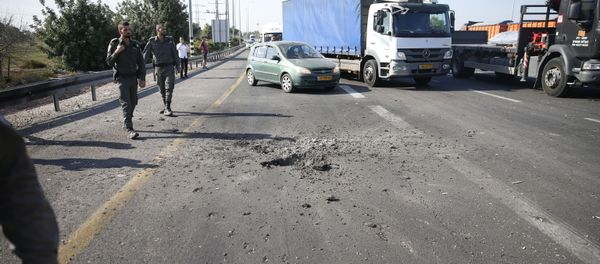 Israeli police block the road moments after a rocket fired by Palestinians militants from Gaza hit a main free way between Ashdod and Tel Aviv near Ashdod Israel, Tuesday, Nov. 12, 2019 - Sputnik International