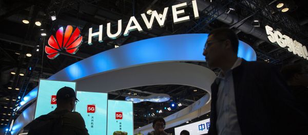 Attendees walk past a display for 5G services from Chinese technology firm Huawei at the PT Expo in Beijing, Thursday, Oct. 31, 2019 Attendees walk past a display for 5G services from Chinese technology firm Huawei at the PT Expo in Beijing, Thursday, Oct. 31, 2019 - Sputnik International