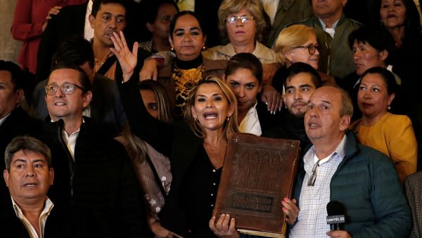 Bolivian Senator Jeanine Anez gestures as she poses for a picture after she declared herself as Interim President of Bolivia, at the Presidential Palace, in La Paz, Bolivia November 12, 2019 - Sputnik International