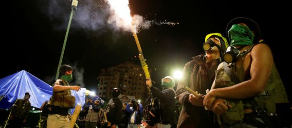Members of Youth Resistance Cochala set off fireworks to celebrate after Bolivian Senator Jeanine Anez became interim president, following Bolivia's former President Evo Morales' departure from the country, in Cochabanba, Bolivia November 12, 2019 - Sputnik International
