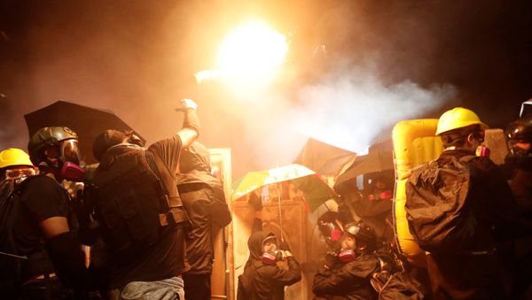 A protesters throws a molotov cocktail during a standoff with riot police at the Chinese University of Hong Kong, Hong Kong, China November 12, 2019 A protesters throws a molotov cocktail during a standoff with riot police at the Chinese University of Hong Kong, Hong Kong, China November 12, 2019 - Sputnik International