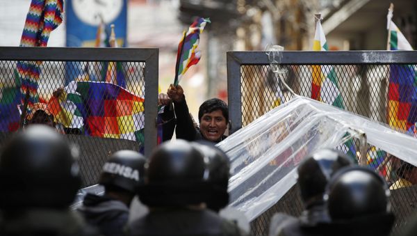 Police block supporters of former President Evo Morales from entering the area of Congress in La Paz, Bolivia, Tuesday, Nov. 12, 2019.  - Sputnik International