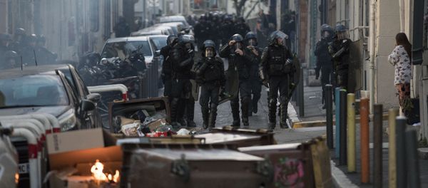 Police approach a barricade made by protesters during a yellow vest demonstration marking the one year anniversary of the movement in Marseille, southern France, Saturday, Nov. 16, 2019. Police are deployed around key sites in Paris as France's yellow vest protesters prepare to mark the first anniversary of their sometimes-violent movement for economic justice. Police approach a barricade made by protesters during a yellow vest demonstration marking the one year anniversary of the movement in Marseille, southern France, Saturday, Nov. 16, 2019. Police are deployed around key sites in Paris as France's yellow vest protesters prepare to mark the first anniversary of their sometimes-violent movement for economic justice. - Sputnik International