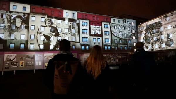 People stand in front of a projection on the former Stasi secret police headquarters in Berlin, Germany, November 4, 2019 - Sputnik International