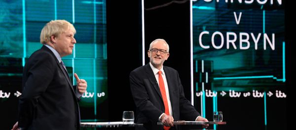 Conservative leader Boris Johnson and Labour leader Jeremy Corbyn are seen during a televised debate ahead of general election in London, Britain, November 19, 2019. Conservative leader Boris Johnson and Labour leader Jeremy Corbyn are seen during a televised debate ahead of general election in London, Britain, November 19, 2019. - Sputnik International