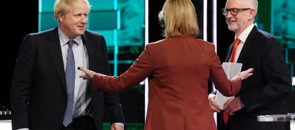 Conservative leader Boris Johnson and Labour leader Jeremy Corbyn are seen during a televised debate ahead of general election in London, Britain, November 19, 2019 Conservative leader Boris Johnson and Labour leader Jeremy Corbyn are seen during a televised debate ahead of general election in London, Britain, November 19, 2019 - Sputnik International