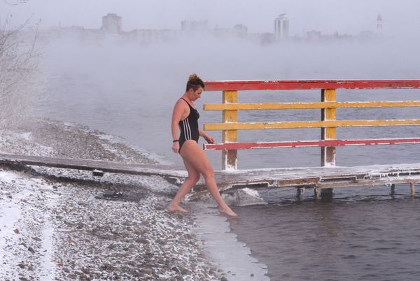 A woman prepares to open the season of ice water swimming in the Yenisey River in Krasnoyarsk A woman prepares to open the season of ice water swimming in the Yenisey River in Krasnoyarsk - Sputnik International