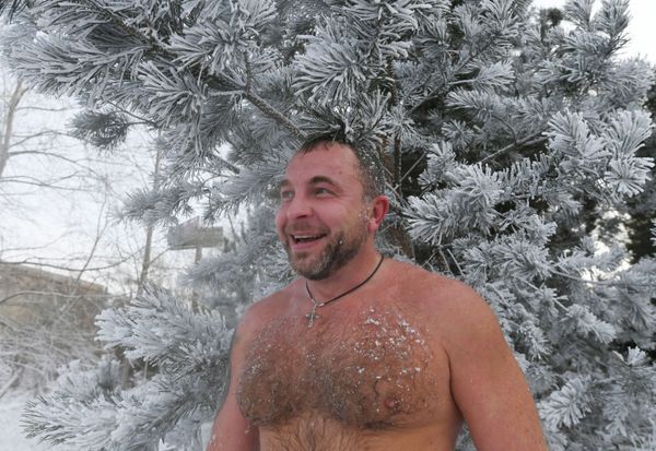 A man smiles after a swim in the icy water in Krasnoyarsk A man smiles after a swim in the icy water in Krasnoyarsk - Sputnik International