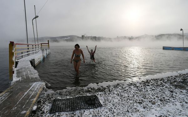 Women pose for photos during preparations for the cold water swimming competitions in the Yenisei River in Krasnoyarsk. Russian 'morzhi' ('walruses') say that cold water swimming has many health benefits. Women pose for photos during preparations for the cold water swimming competitions in the Yenisei River in Krasnoyarsk. Russian 'morzhi' ('walruses') say that cold water swimming has many health benefits. - Sputnik International