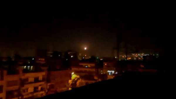 Light in the sky, believed to be a missile, is seen the city in Damascus, Syria November 20, 2019 - Sputnik International