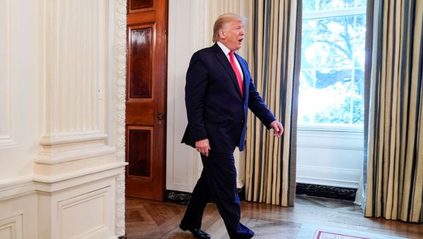 US President Donald Trump arrives to greet college athletes during an NCAA Champions Day  - Sputnik International