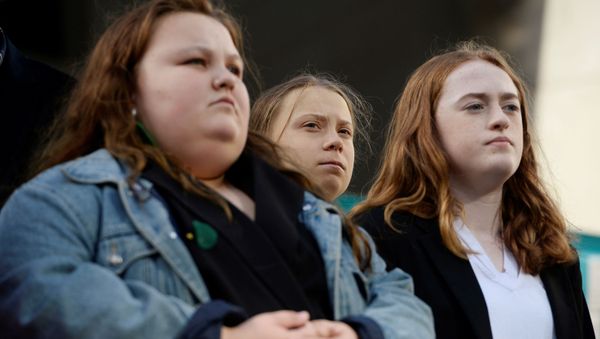 Climate change teen activist Greta Thunberg stands with youth who plan to sue the federal government at a climate strike at the Vancouver Art Gallery in Vancouver, British Columbia, Canada October 25, 2019 - Sputnik International