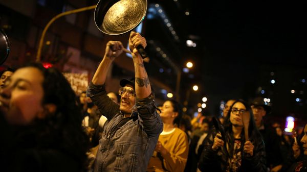 A demonstrator bangs a pan during a protest on the second day of a national strike, in Bogota, Colombia, 22 November 2019.  - Sputnik International