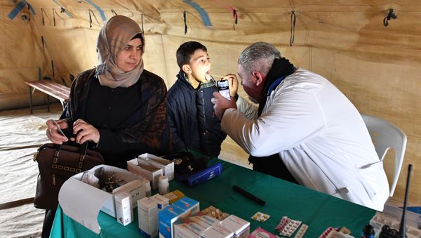 Provision of medical assistance to refugees in the Abu Duhur humanitarian corridor in the vicinity of Idlib province - Sputnik International