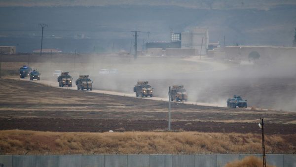 Turkish and Russian military vehicles return following a joint patrol in northeast Syria, as they are pictured from near the Turkish border town of Kiziltepe in Mardin province, Turkey, November 1, 2019. - Sputnik International