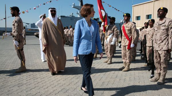 French Defence Minister Florence Parly and United Arab Emirates' Minister of State for Defence Mohammed Bin Ahmad al-Bawardi inspect members of an honour guard during a military ceremony at the French Naval Base in Abu Dhabi, United Arab Emirates November 24, 2019 - Sputnik International