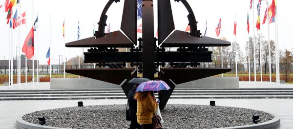 People hold umbrellas outside NATO headquarters in Brussels, Belgium, November 26, 2019 People hold umbrellas outside NATO headquarters in Brussels, Belgium, November 26, 2019 - Sputnik International