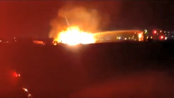 An Israeli Air Force S65C-3 Yasur helicopter on fire following an emergency landing in the Negev - Sputnik International