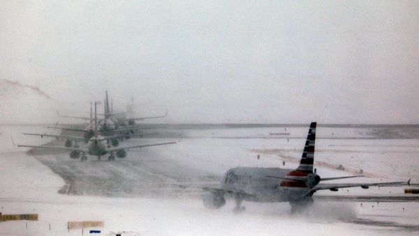A line of jets wait to takeoff after a pre-Thanksgiving holiday snowstorm caused more than 460 flight cancellations at Denver International Airport, Colorado, U.S., November 26, 2019.  - Sputnik International