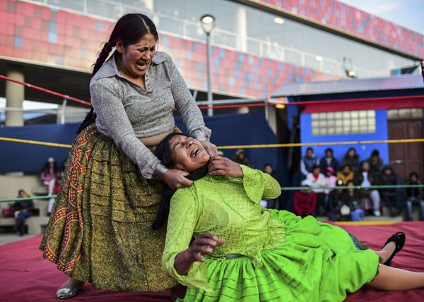 Bolivian wrestler Ana Luisa Yujra (L), aka Jhenifer Two Faces and Lidia Flores, aka Dina, The Queen of the Ring, both members of the Fighting Cholitas, fight at the Sharks of the Ring wrestling club in El Alto, Bolivia, on 24 November 2019. Bolivian wrestler Ana Luisa Yujra (L), aka Jhenifer Two Faces and Lidia Flores, aka Dina, The Queen of the Ring, both members of the Fighting Cholitas, fight at the Sharks of the Ring wrestling club in El Alto, Bolivia, on 24 November 2019. - Sputnik International
