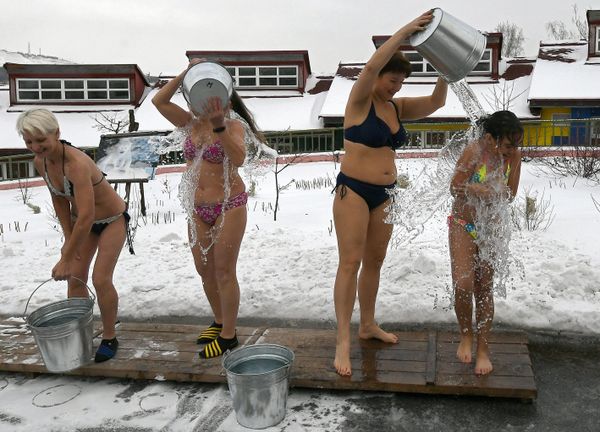 Members of cold training club Polar Bear pour freezing water over themselves during the celebration of International Polar Bear Day near Krasnoyarsk, Russia. Members of cold training club Polar Bear pour freezing water over themselves during the celebration of International Polar Bear Day near Krasnoyarsk, Russia. - Sputnik International