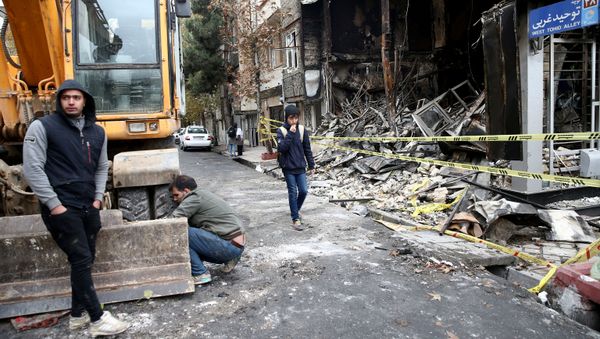 FILE PHOTO: People walk near a burnt bank, after protests against increased fuel prices, in Tehran, Iran November 20, 2019 FILE PHOTO: People walk near a burnt bank, after protests against increased fuel prices, in Tehran, Iran November 20, 2019 - Sputnik International
