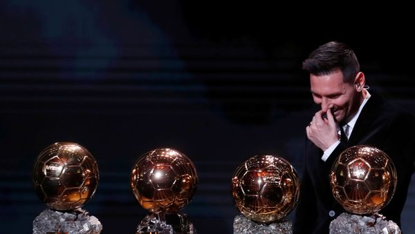 December 2, 2019  Barcelona's Lionel Messi with his Ballon d'Or trophies - Sputnik International